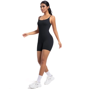 Detailed view of black slim-fit yoga bodysuit with thin straps and U-neckline design