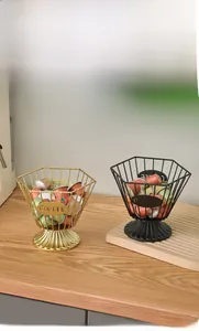 Detail of matte black and gold coffee capsule holder with hexagon wire design