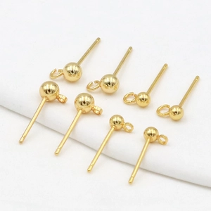 Macro view of 14K gold plated dot earring studs with S925 silver needles and hanging loops