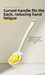 Detail of ergonomic curved long handle on a floral soft bristle back scrubber brush