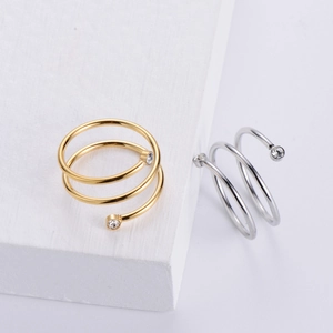 Elegant spiral stainless steel rings in gold and silver with sparkling rhinestones