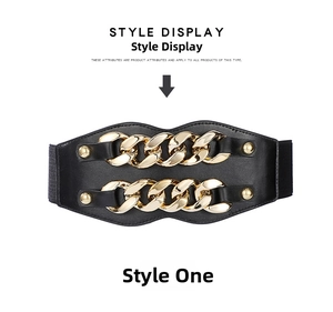 Detail of black elastic corset belt featuring double gold chain and punk style rivets