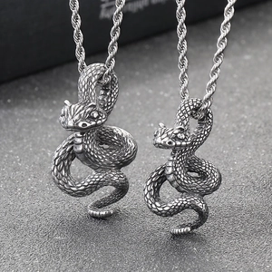 Dark punk style coiled python pendant in vintage oxidized black stainless steel