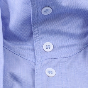 Women's light blue striped commuter shirt with fine fabric texture and white buttons