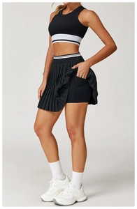 Detail view of the functional side pocket on inner shorts of black pleated sports skirt