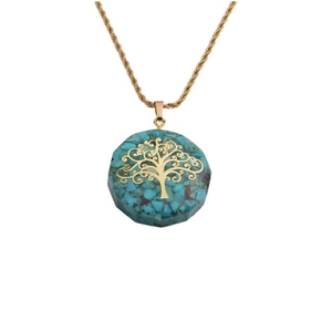 Detail of turquoise gravel stone and golden tree of life pendant on twisted chain