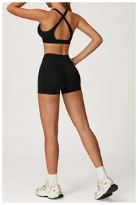 Back view of black racerback sports bra and high-waisted seamless fitness shorts set