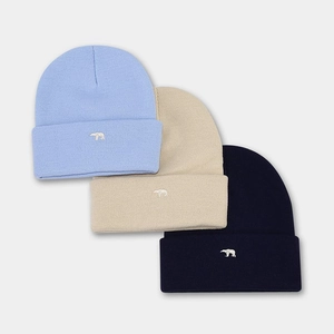 Three-color set of knitted beanies with polar bear embroidery in blue, beige, and navy