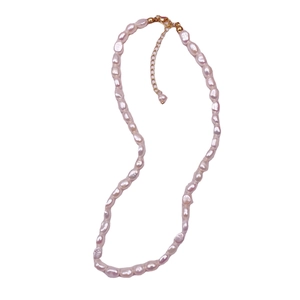 Light pink baroque freshwater pearl necklace with 14k gold plated lobster clasp on white background