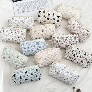 Quilted cotton cosmetic pouch with cute cartoon patterns and zipper closure for storage
