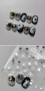 Nahaufnahme von 5D-Nagelstickern mit dunklen Sternen und Fadenkreuzmustern im Punk-Stil