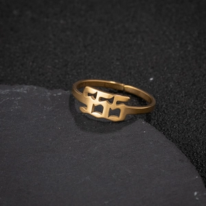 Macro shot of gold stainless steel adjustable ring featuring hollow 555 angel number design
