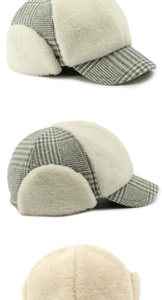 Close-up of winter plush baseball cap featuring grey plaid fabric and warm fleece lining