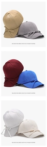 Detail view of baseball caps in various colors with decorative side bows and soft texture