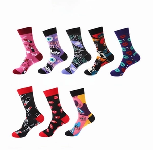 Flat lay view of eight cotton crew socks with lips and eyes fashion patterns