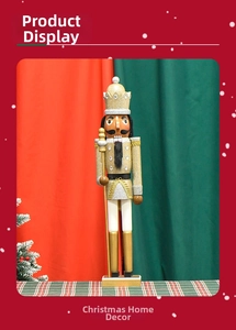 Detail of glittery gold nutcracker king with scepter against Christmas backdrop