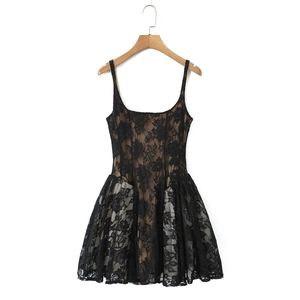 Detail of black lace sleeveless dress featuring a suspender design and A-line silhouette