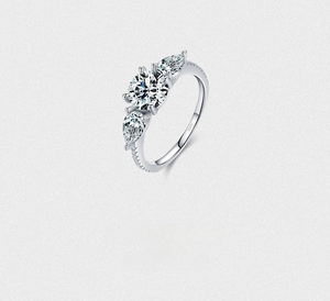 Detailed macro view of S925 sterling silver ring showing the three-stone setting and engraving