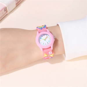 Close-up of pink children's watch featuring 3D butterfly silicone strap and numeric dial