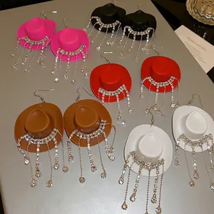 Cowboy hat earrings with rhinestone tassels in multiple colors like pink and black