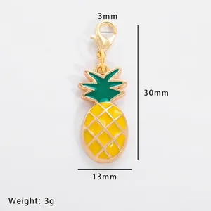 Detail of yellow pineapple alloy charm with lobster clasp and dimensional measurements