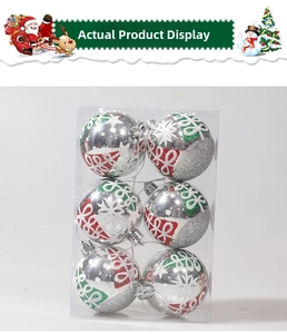 Detailed view of silver Christmas balls with glitter snowflake patterns in a 6-piece box