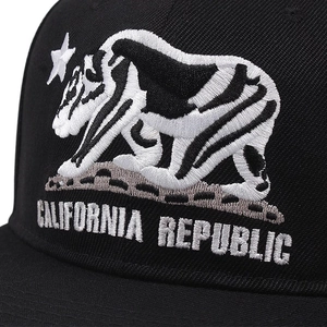 Close-up of California Republic embroidery on a black cotton twill baseball cap