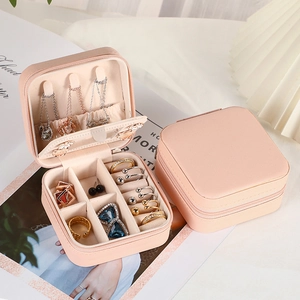Pink leather square jewelry travel case with zipper closure and internal mirror