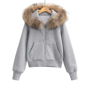 Detail of light grey hooded sweatshirt featuring a detachable faux fur trim collar