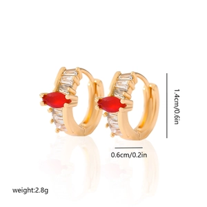Detail view of gold earrings with baguette crystals and red marquise stone and measurements