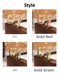 Detailed view of four pairs of 925 silver hoop earrings with multicolored cubic zirconia
