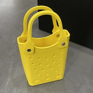 Top view of yellow EVA beach bag showing perforated texture and waterproof material