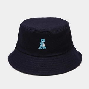 Detailed view of navy blue cotton bucket hat with cute blue dinosaur embroidery