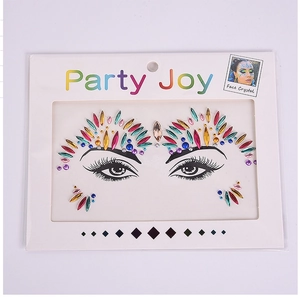 Close-up of colorful acrylic face crystals and rhinestone stickers for makeup party