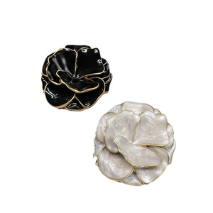 Classic black and white enamel double-layer flower brooches with golden finish details