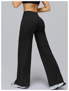 Side view of black high-waisted wide-leg yoga pants with compression waistband