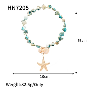 Detail of beach style necklace with shells, starfish, pearls and 53cm size markings