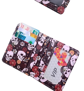 Detail view of the spider skull print wallet interior with multiple card slots and window