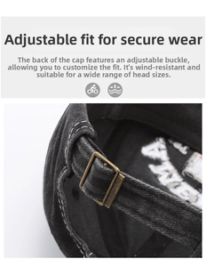 Detail of adjustable bronze buckle on vintage washed black cotton baseball cap