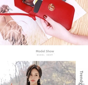 Detail of red pebbled leather phone bag with gold metal clasp and back card slot feature