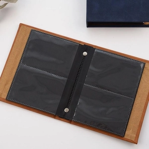 Detailed view of brown faux leather insert with two clear photo pockets for mini album