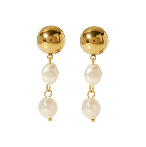 Close-up of gold stainless steel drop earrings featuring dual baroque pearls on white backdrop
