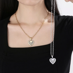 Detail showing gold and silver hollow heart necklaces with micro-inlaid zircon jewelry