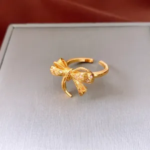 18K gold plated bow open ring with cubic zirconia accents in a high-end luxury style