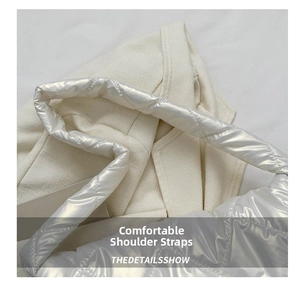 Detail of a padded quilted shoulder strap on a space cotton bag with metallic finish
