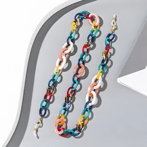 Macro shot of colorful acrylic eyeglass chain with golden lobster clasps and non-slip loops