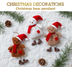 Three plush Christmas bears with red hats and scarves on pine branches and snow