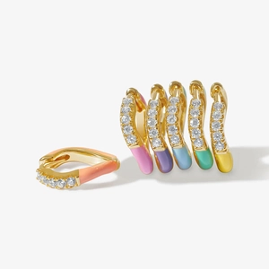 Detailed close-up of rainbow enamel gold earrings with micro-set white zircon stones