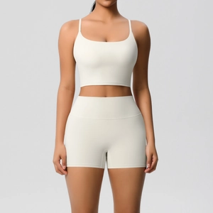 Front view of cream yoga set with square neck tank top and high waist slim shorts