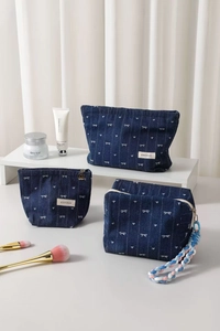 Three-piece denim makeup bag set with heart bow patterns and floral charms